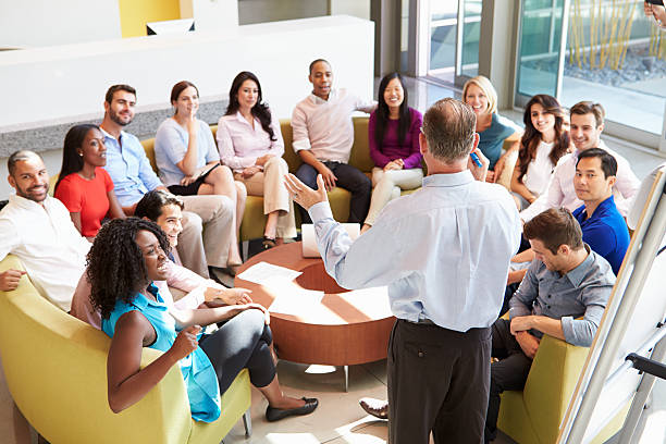 istock Businessman presenting to diverse group of colleagues 469723893