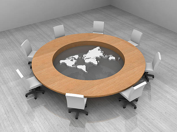 istock illustration of a conference room with round table and map 469724521