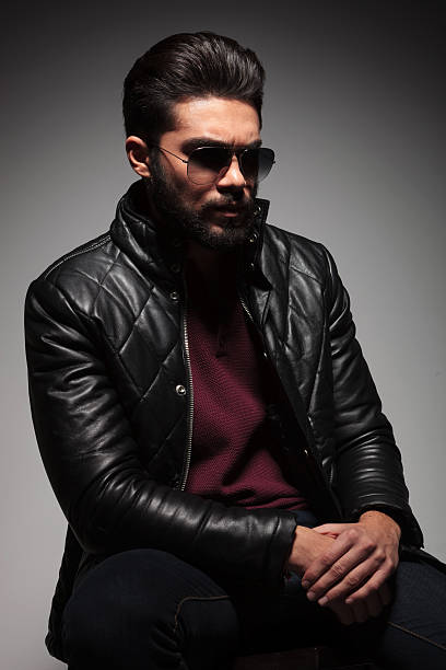istock artistic pose of a dramatic fashion young man with beard 469727963