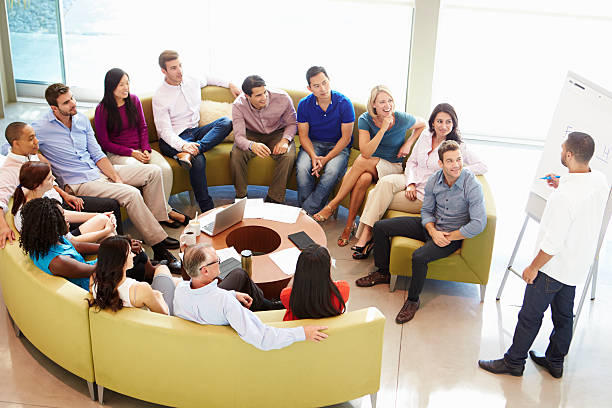 istock Businessman Making Presentation To Office Colleagues 469729645