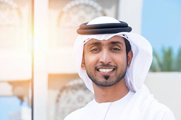 istock Middle Eastern businessman standing outside an office block and smile 469733268