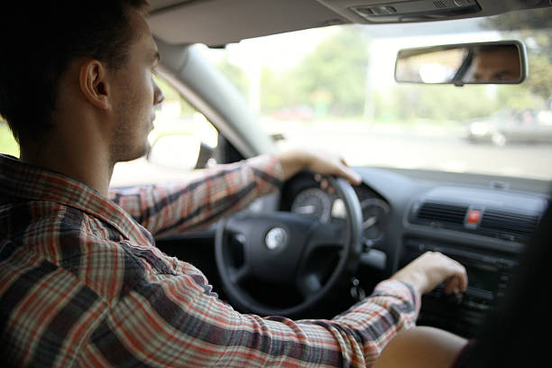 istock inside the car driver driving on the road 469733292