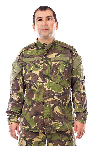 istock Portrait of a young soldier looking at camera isolated 469733737