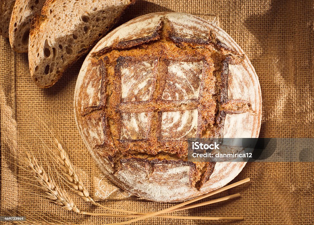 Rustic bread and wheat on a traditional cloth 2015 Stock Photo