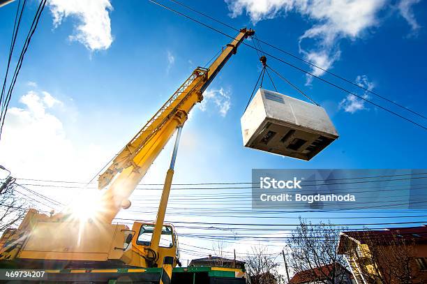 Mobile Crane Operating By Lifting And Moving Electric Generator Stock Photo - Download Image Now