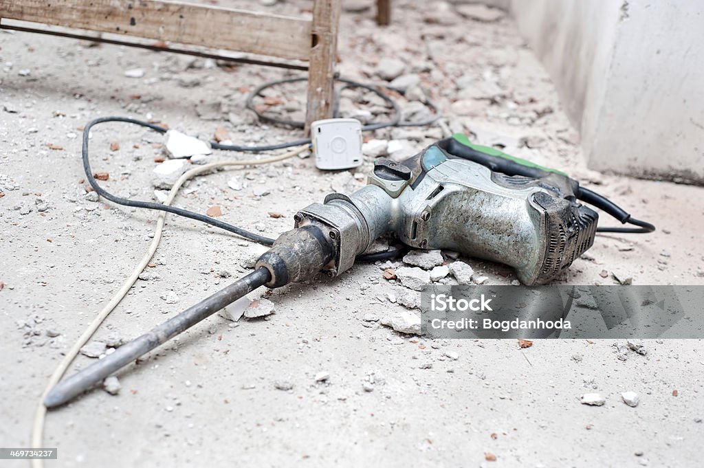 Bau-tool, das Presslufthammer durch Abbrucharbeiten dass kein Schmutz in den Schuh gelangt - Lizenzfrei Abbrechen Stock-Foto
