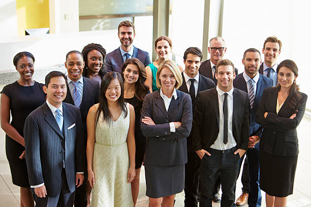 istock Multi-cultural office staff standing in lobby 469735239