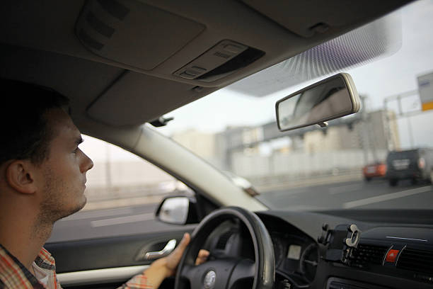 istock inside the car driver driving on the road 469737656