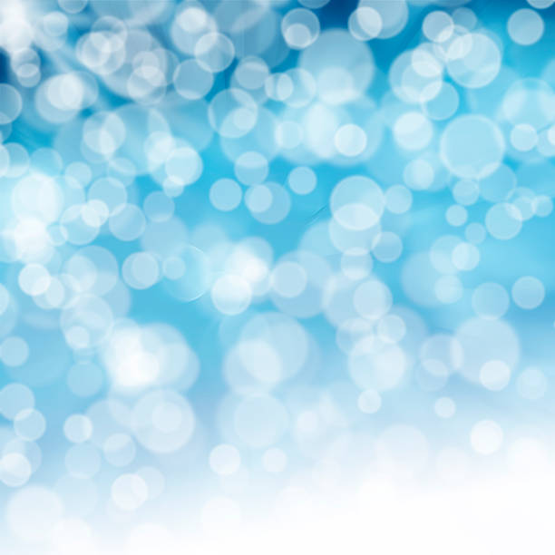 istock Blue rays of light with bubbles and glitters 469738296