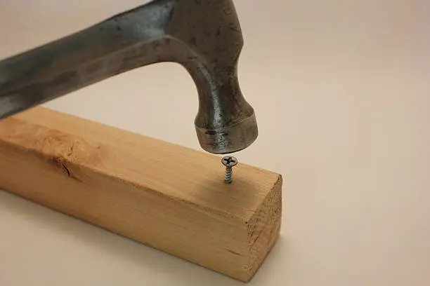 A hammer trying to point in a screw. It's the wrong tool for the job.
