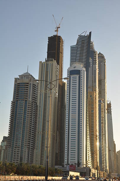 Dubai, UAE - December 22, 2011: Sheikh Zayed Road skyscrapers in Dubai, UAE. The Sheikh Zayed Road (E11 highway) is home to most of Dubai's skyscrapers, including the Emirates Towers.