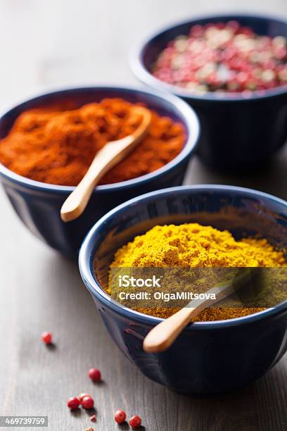 Spices In Bowls Curry Pink And Black Pepper Paprika Powder Stock Photo - Download Image Now