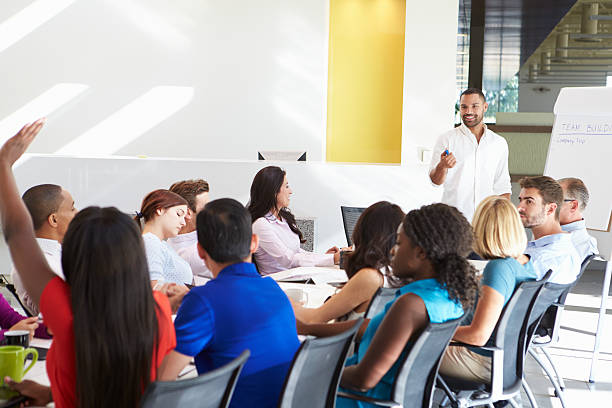 istock Man dressed casually in a meeting addressing someone 469740039