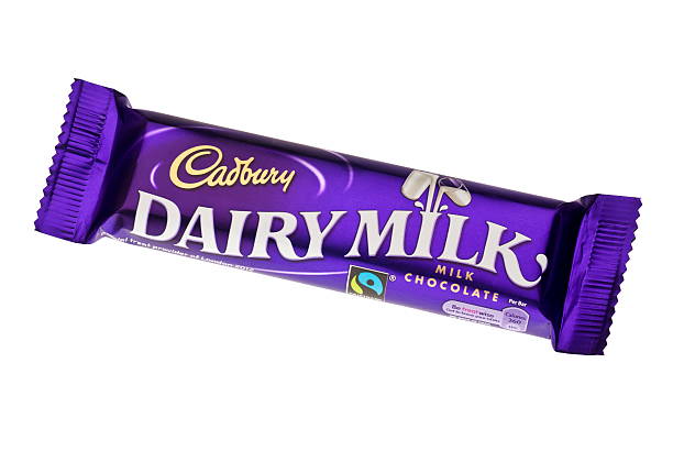 Bar of Cadbury Dairy Milk Chocolate - 2011 London, England - April 24, 2011: Bar of Cadbury Dairy Milk Chocolate, Which is made in the United Kingdom. cadbury plc photos stock pictures, royalty-free photos & images