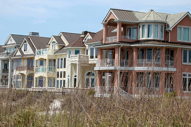 istock View of Beach Homes beyond the dry grass 469741886