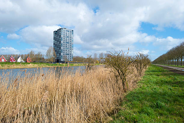 istock Highrise along he shore of a canal in spring 469742244
