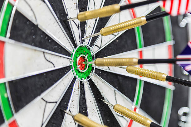 istock Dart board with darts on bullseye 469742944