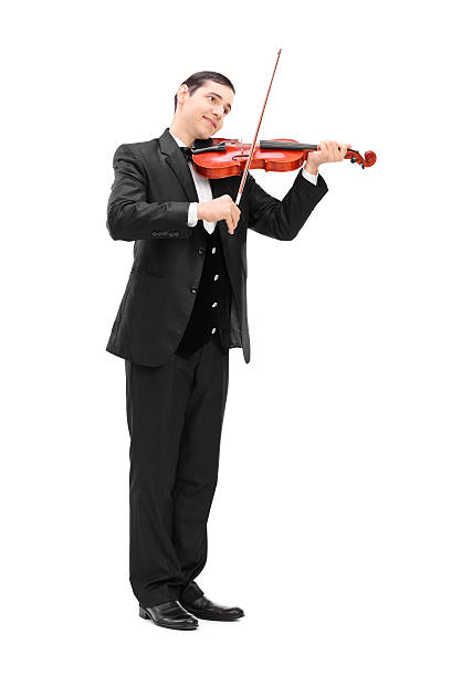 Full length portrait of a elegant musician playing an acoustic violin isolated on white background