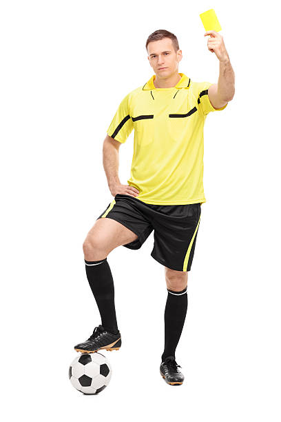 istock Young football referee showing a yellow card 469743298
