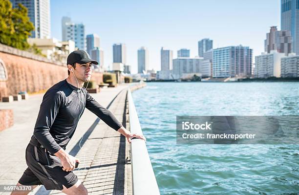 Tired Man Doing Stretching On The City Stock Photo - Download Image Now - 20-29 Years, 2015, 30-39 Years