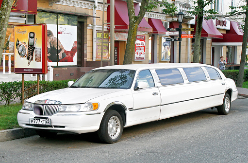 Sochi, Russia - July 19, 2009: White Lincoln Town Car limousine parked at the city street.