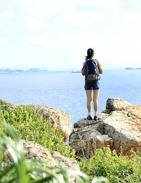 istock young woman hiker seaside 469749147