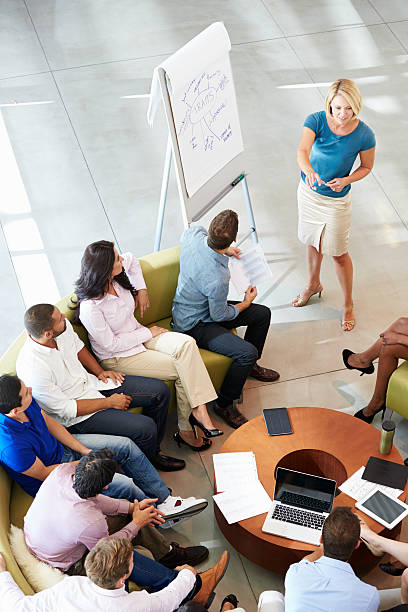 istock Businesswoman making presentation to colleagues 469749791
