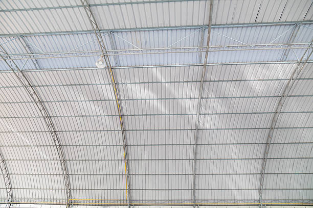 istock metal roofing construction of modern building complex 469750110