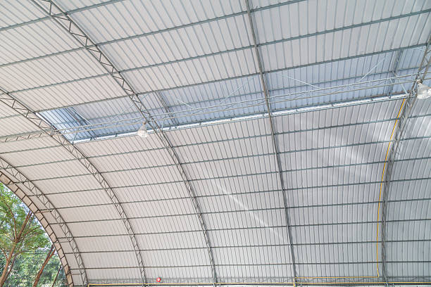 istock metal roofing construction of modern building complex 469750112