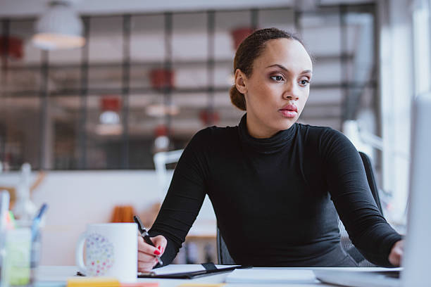 istock Young woman working new business assignment 469750438