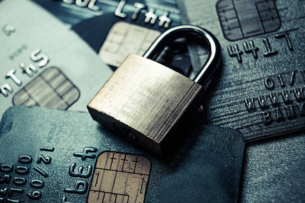 Credit card data security a security lock on credit cards - credit card data encryption concept penetration stock pictures, royalty-free photos & images