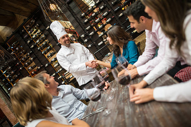 istock Customers congratulating the chef at a restaurant 469754298