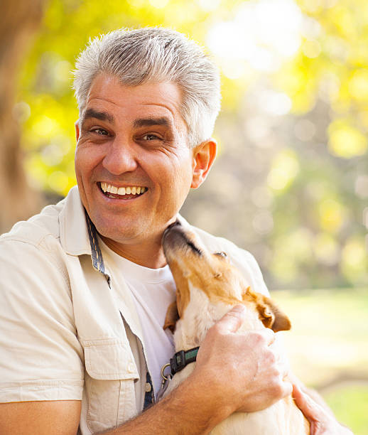 istock middle aged man and pet dog 469754765
