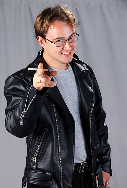 istock young man in leather Jacket with cigarette 469755267