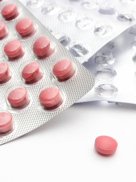 istock Full and empty pill blister on white background 469755299