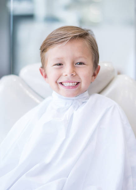 istock Boy looking happy about his haircut 469757284