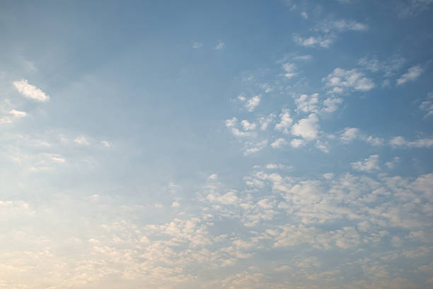 Abstract white cloud over yellow and blue sky during dawn background