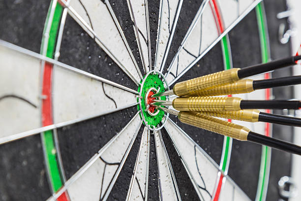 istock Dart board with darts on bullseye 469757422
