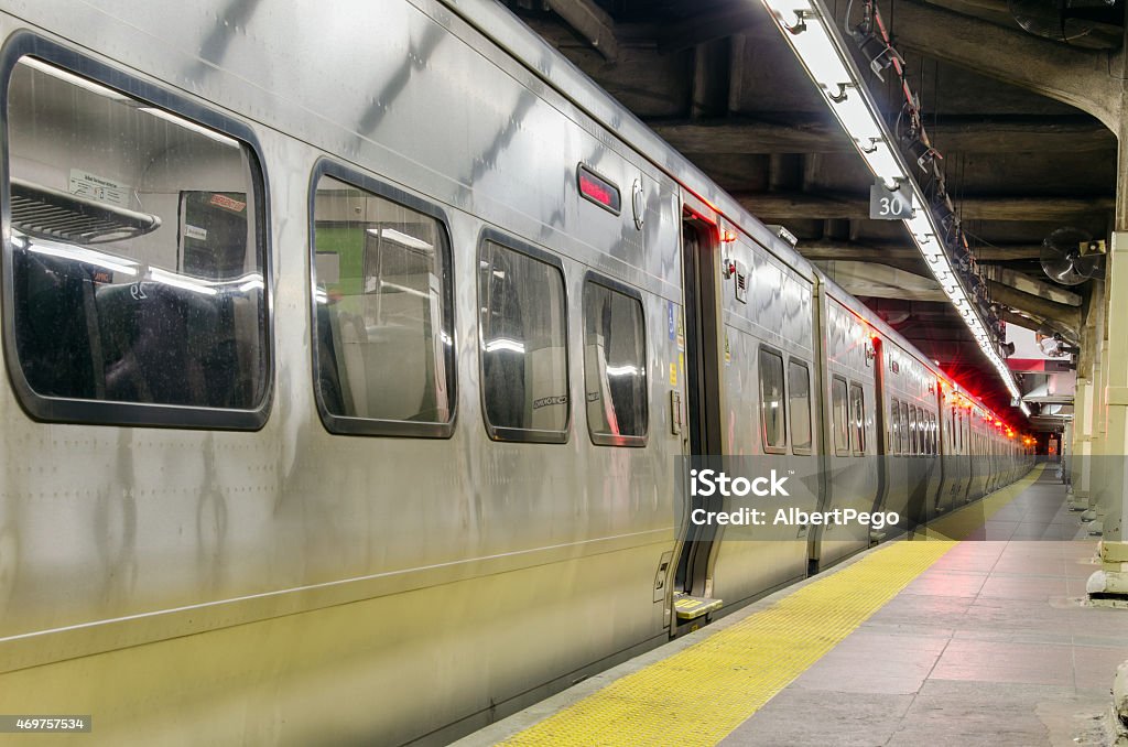 Commuter Train Waiting at Platform Commuter train standing at a deserted platform of Grand Central Terminal in Manhattan, New York New York City Stock Photo