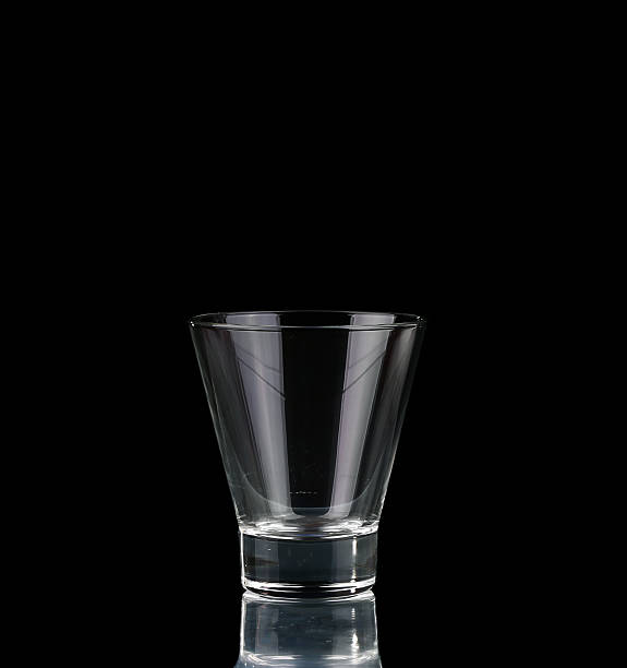 istock empty glass on a black background. Shoot the glass 469757604