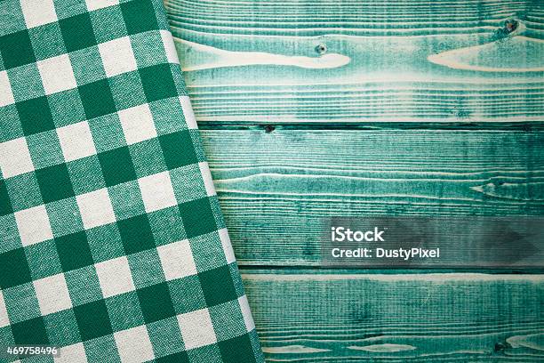 Green Checked Napkin On Green Wooden Picnic Table Stock Photo - Download Image Now - 2015, Checked Pattern, Color Image