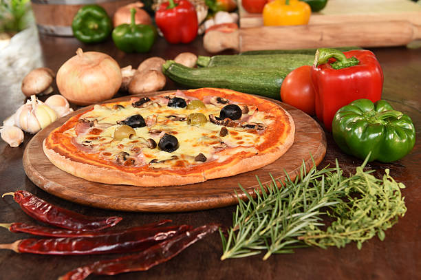 istock Pizza with ham, mushrooms and olives 469758948