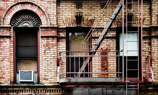 A typical New York building facade showing detail in the fire escape