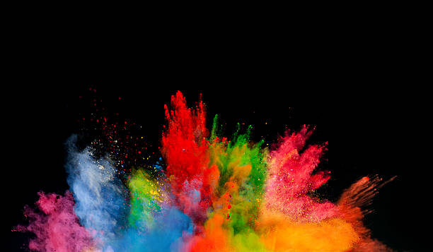 colored dust explosion on black background - kleurenfoto stockfoto's en -beelden