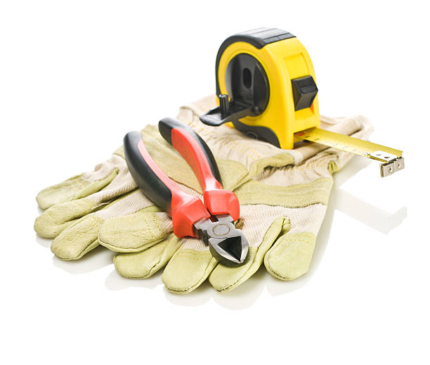 istock pliers and tapeline on gloves 469759306