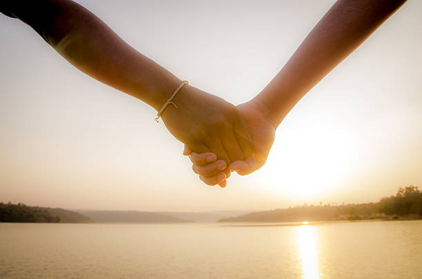 istock Couple hand in hands nearly the lake 469760989
