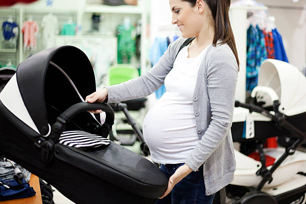 Pregnant woman shopping stock photo