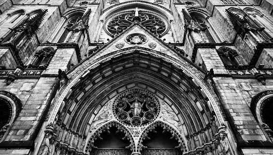 A Black and White Frontal view shot of the Cathedral Church of Saint John the Divine in New York city, USA.