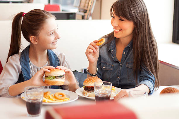 istock A mother with her daughter at a restaurant 469763176