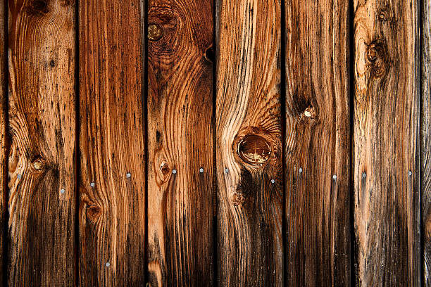 istock Fence made of wooden planks with visible grain marks 469763812
